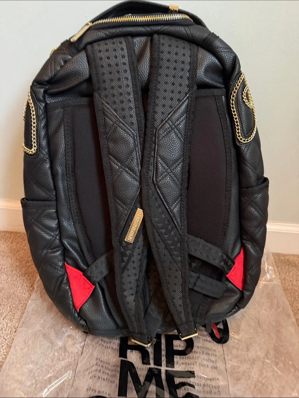 Quilted Black Backpack with Gold Chain Trim